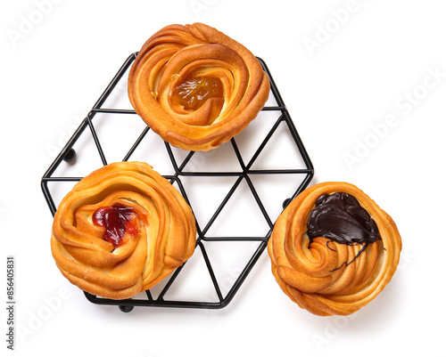 Grid with tasty cruffins with chocolate and jam on white background photo