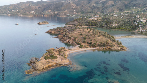 Aerial panorama of the city and harbor of Poros island in the Saronic Gulf, Greece, during a colorful summer sunset