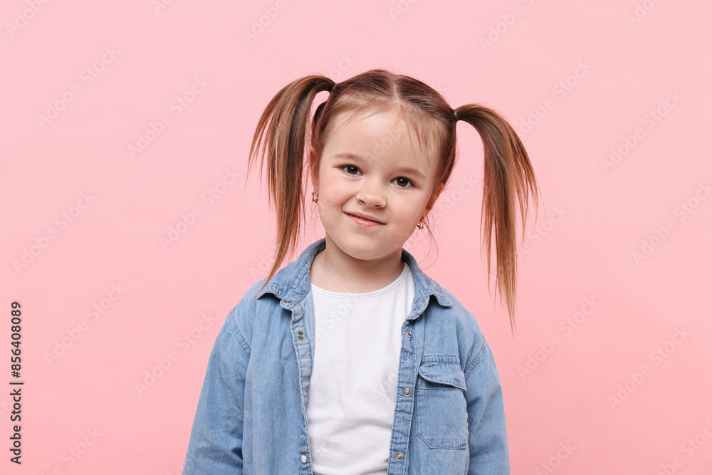 Portrait of cute little girl on pink background Portrait of cute little girl on pink background