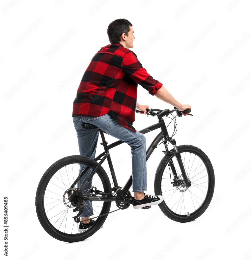 Obraz premium Young man riding bicycle on white background
