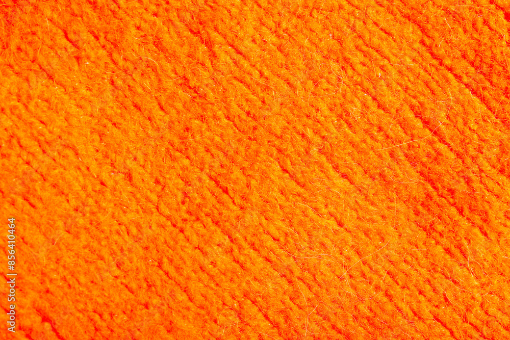 Fototapeta premium Orange fabric texture, knitted wool material background with diagonal lines