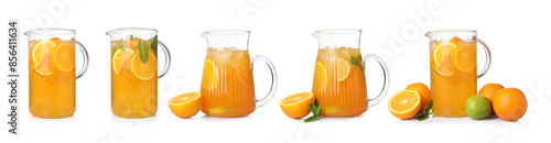 Fotografie Glass jugs with refreshing orange drink isolated on white, set