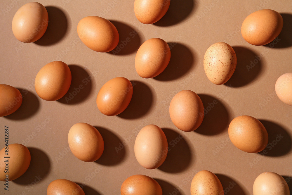 Raw chicken eggs on brown background Raw chicken eggs on brown background