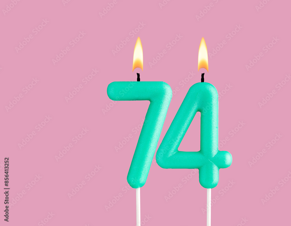 Birthday card with green number 74 candle - Pastel pink background Birthday card with green number 74 candle - Pastel pink background