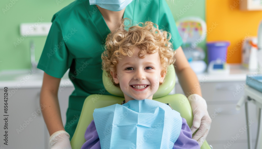 A young boy is sitting in a dentist's chair with a smiling face A young boy is sitting in a dentist's chair with a smiling face