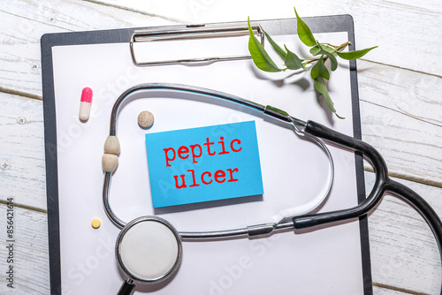 marker and paper with the inscription - Peptic ulcer photo