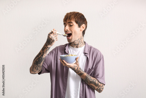 Man eating cereal rings on ...