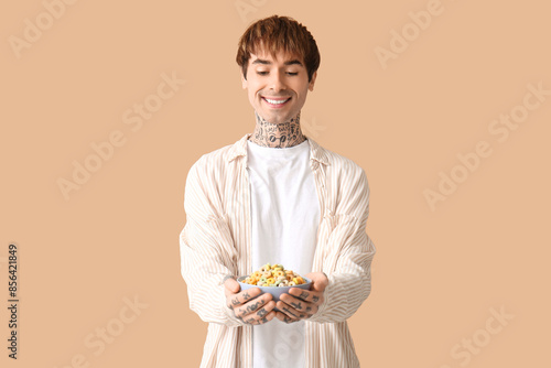 Man holding bowl with cerea...