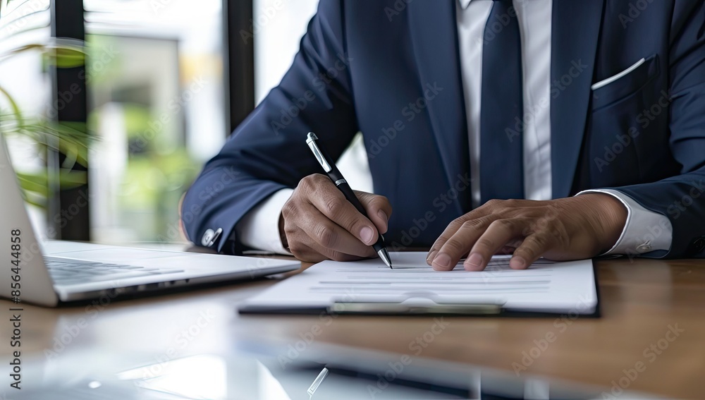 Businessman Signing a Document Businessman Signing a Document