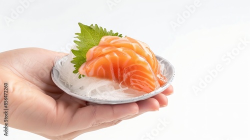 Sashimi with salmon in a woman hand isolated on a white background : Generative AI photo