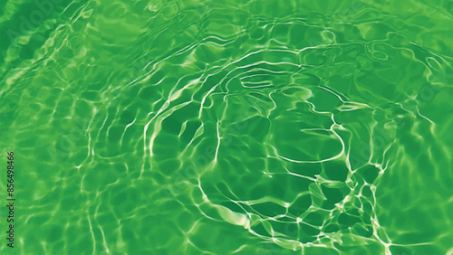 Blue water with ripples on the surface. Defocus blurred transparent blue colored clear calm water surface texture with splashes and bubbles. Water waves with shining pattern texture background.