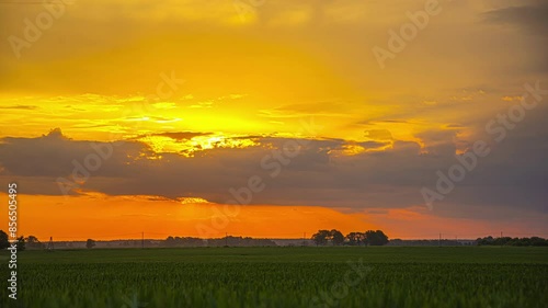 Agriculture farmland fields and glowing sunrise, time lapse view photo