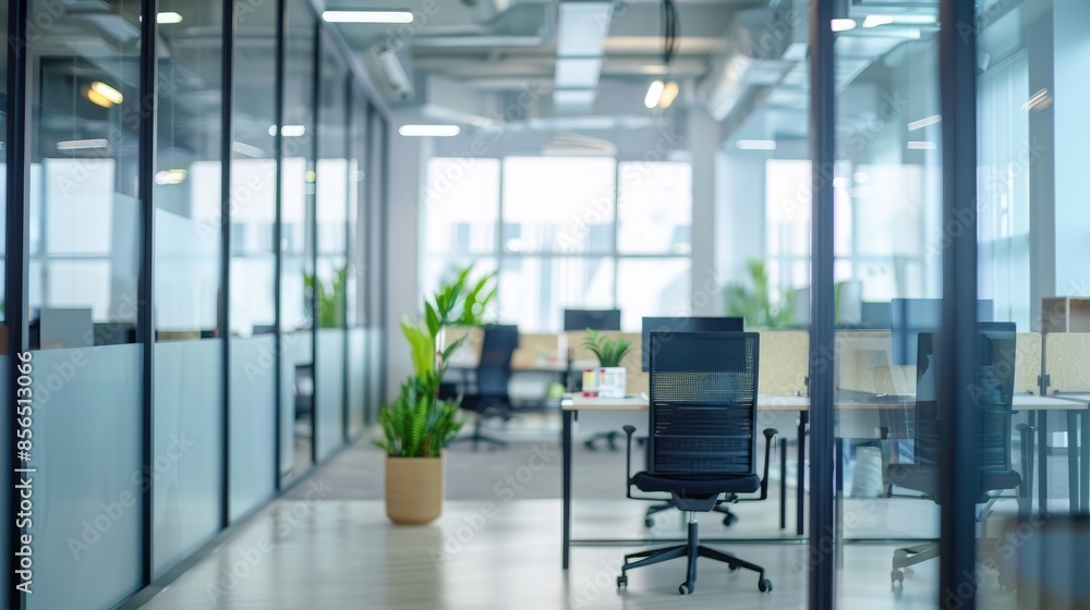 Interior of modern office with white walls, concrete floor, rows of computer tables with black chairs and horizontal mock up poster Interior of modern office with white walls, concrete floor, rows of computer tables with black chairs and horizontal mock up poster