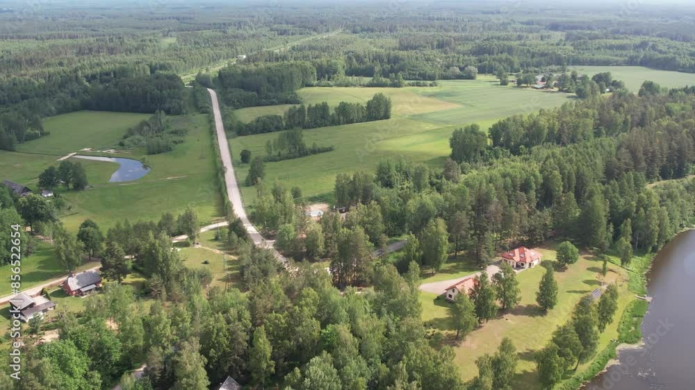 A drone view of Brenguli village, capturing its quaint rural charm with scattered houses, lush green fields, and dense forests. The harmonious blend of natural landscapes and village infrastructure A drone view of Brenguli village, capturing its quaint rural charm with scattered houses, lush green fields, and dense forests. The harmonious blend of natural landscapes and village infrastructure