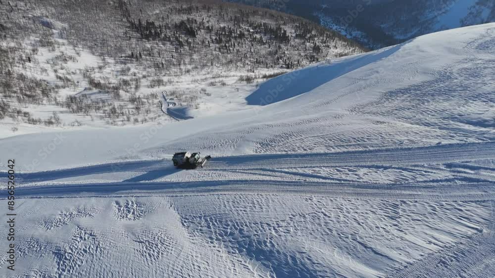 Explore snowy mountains in an offroad vehicle amidst pristine nature and breathtaking vistas Explore snowy mountains in an offroad vehicle amidst pristine nature and breathtaking vistas