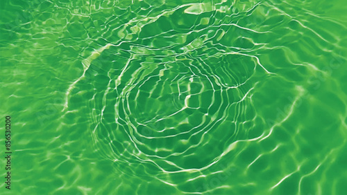 Blue water with ripples on the surface. Defocus blurred transparent blue colored clear calm water surface texture with splashes and bubbles. Water waves with shining pattern texture background.