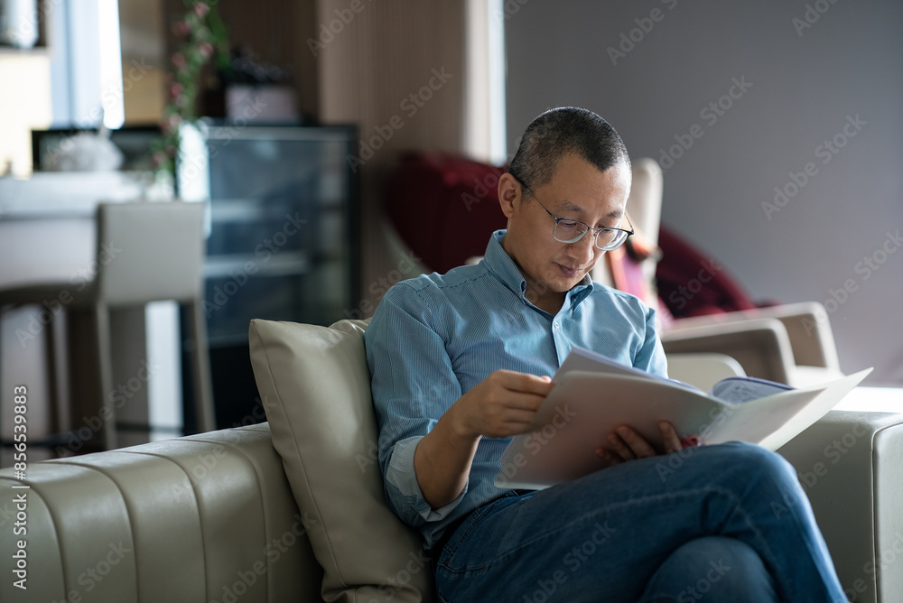 businessman looking document in office businessman looking document in office