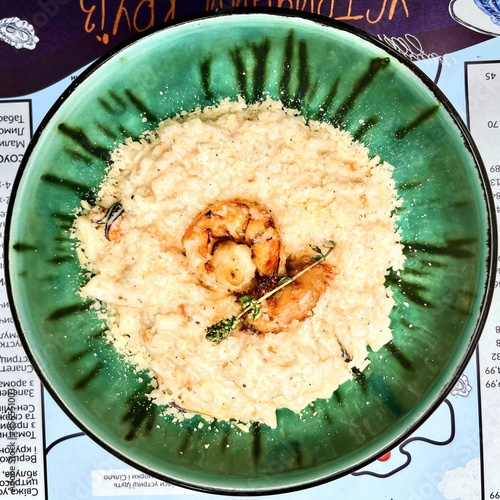 Obraz na płótnie Seafood risotto in a plate w salonie