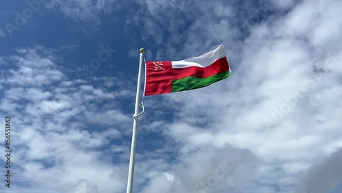 Oman Flag flying with sky behind