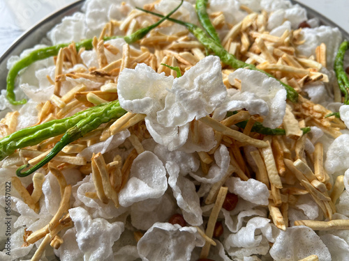 Sabudana Papad or Sago Pappadam with aloo kandi  is a white crunchy big circular shape deep fried snack usually consumed during Vrat or Fast in Hindu religion. photo