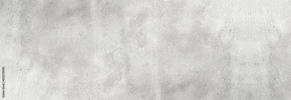Fototapeta premium Large white grunge textured concrete wall background. The backdrop is a rough cement floor in gray and white tones.