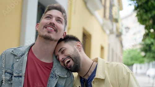 happy homosexual couple walking in the city