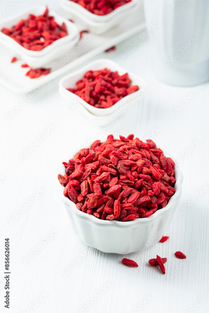 Dried goji berries on a white table. Dried goji berries on a white table.