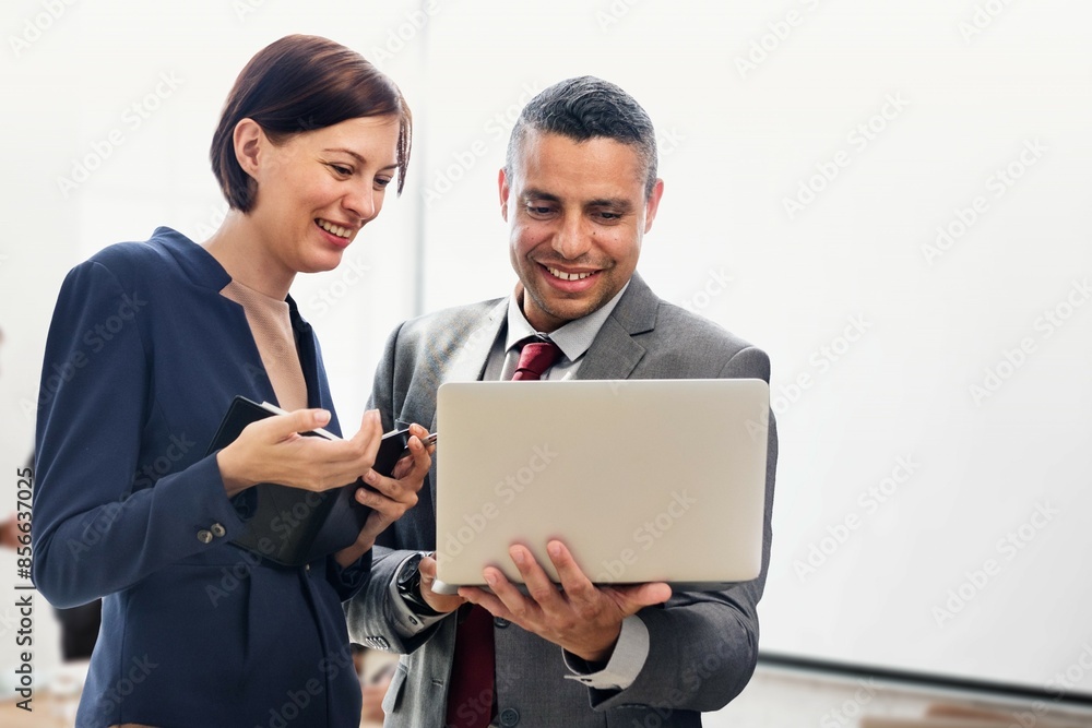 Business coworkers talking over laptop remix Business coworkers talking over laptop remix