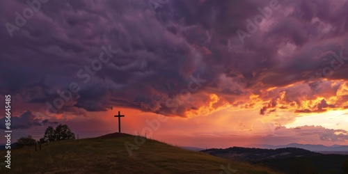 Cross on Hill at Sunset with Dramatic Clouds