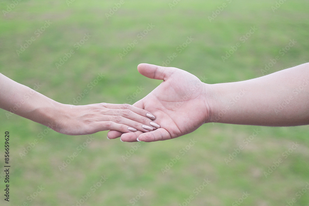 Couples hold hands show friendship love and kindness they have always shown each other and couples can be confident in their love for each other at all times. Background couple holding hands in love Couples hold hands show friendship love and kindness they have always shown each other and couples can be confident in their love for each other at all times. Background couple holding hands in love