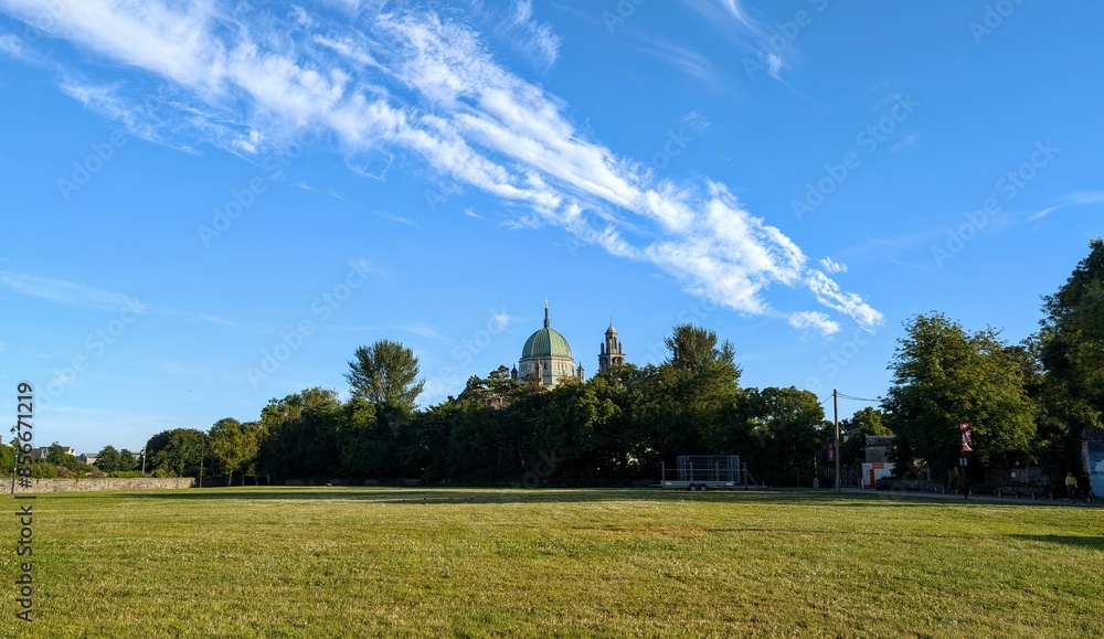 Beautiful sunny scene wit Galway cathedral under clear blue sky with amazing cloudscape, architecture and landmark, Ireland