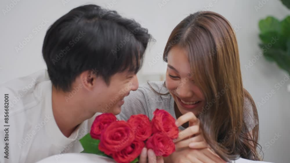 Asian young man surprise and give rose flower to beautiful girlfriend. Asian young man surprise and give rose flower to beautiful girlfriend.