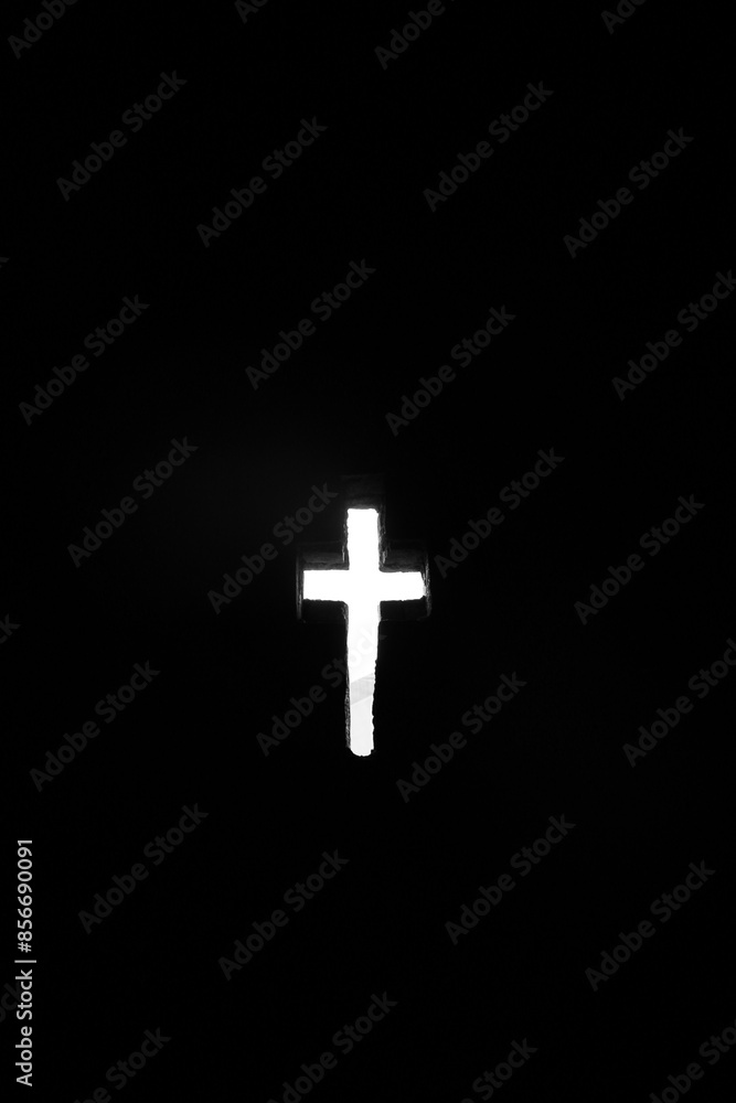 The cross carved into the wall of a church in a darkness in Lalibela, Ethiopia The cross carved into the wall of a church in a darkness in Lalibela, Ethiopia