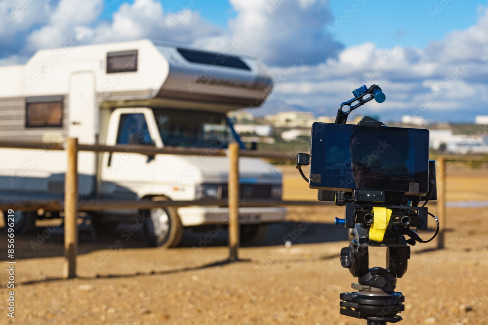 Camera taking picture of caravan on beach Camera taking picture of caravan on beach