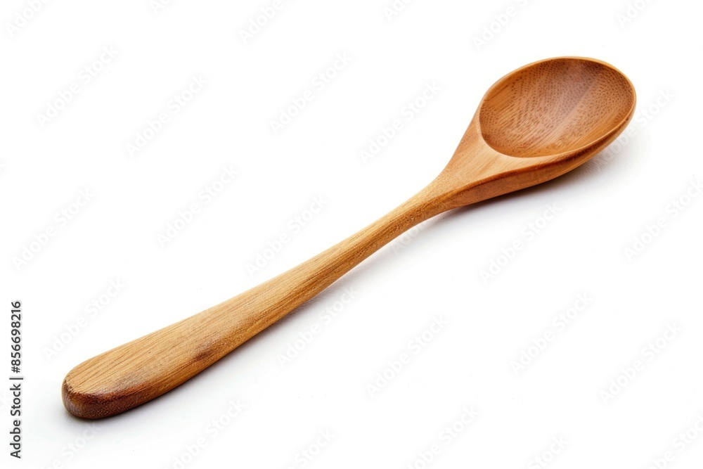 A single wooden spoon lying flat on a white surface A single wooden spoon lying flat on a white surface