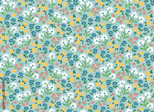 Seamless ditsy floral pattern. Cute garden flowers and leaves colorful pattern. Small blue, purple and orange flowers. Dark blue background. Ditsy print. Liberty template for fashion prints.