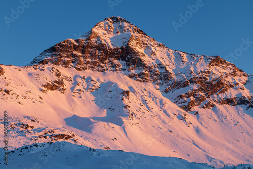 Obraz na plátně the peak of Pizzo Scalino at sunset.