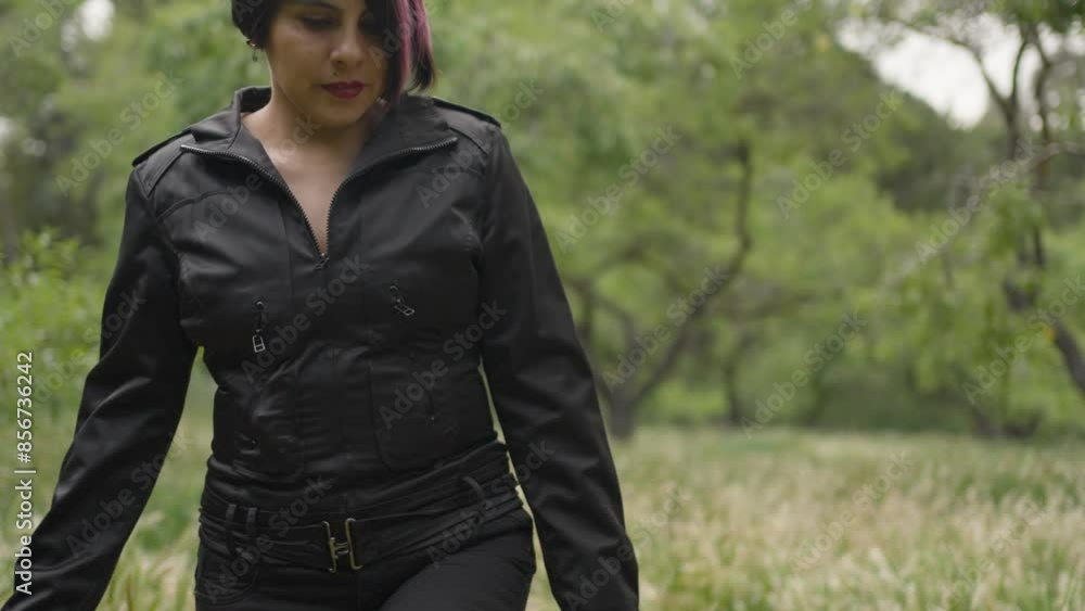 Latino woman dressed in black walking in a field.MOV Latino woman dressed in black walking in a field.MOV