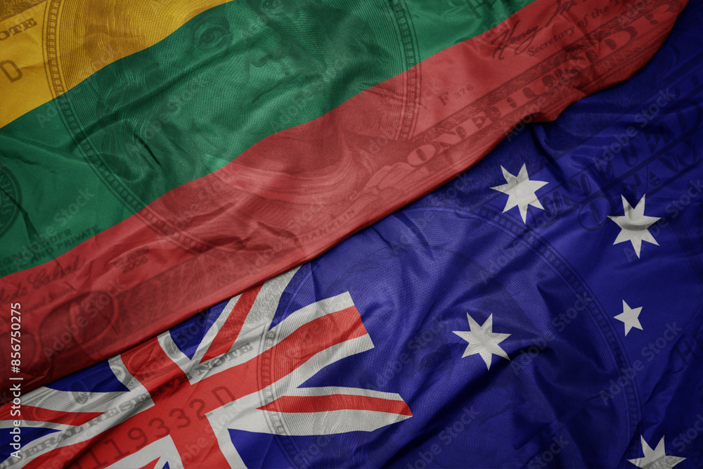 waving colorful flag of lithuania and national flag of australia on the dollar money background. finance concept. waving colorful flag of lithuania and national flag of australia on the dollar money background. finance concept.