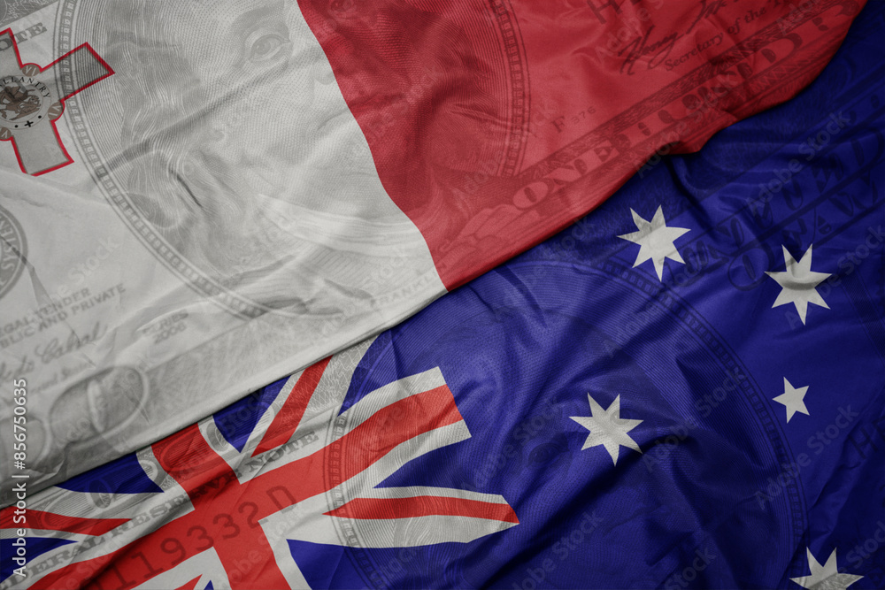 waving colorful flag of malta and national flag of australia on the dollar money background. finance concept. waving colorful flag of malta and national flag of australia on the dollar money background. finance concept.