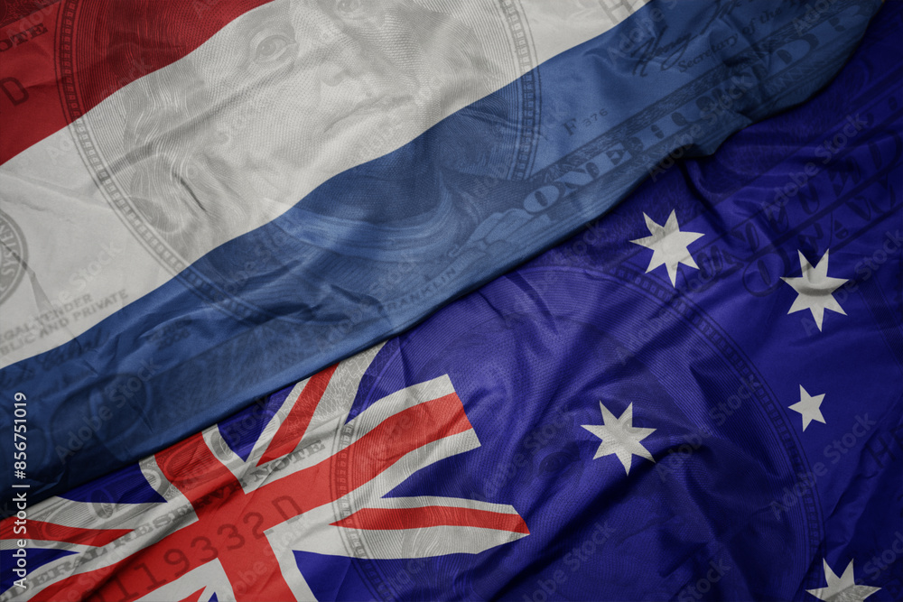 waving colorful flag of netherlands and national flag of australia on the dollar money background. finance concept. waving colorful flag of netherlands and national flag of australia on the dollar money background. finance concept.
