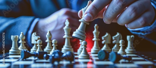 Strategic Chess Move: A Close-Up of a Player's Hand © vixion
