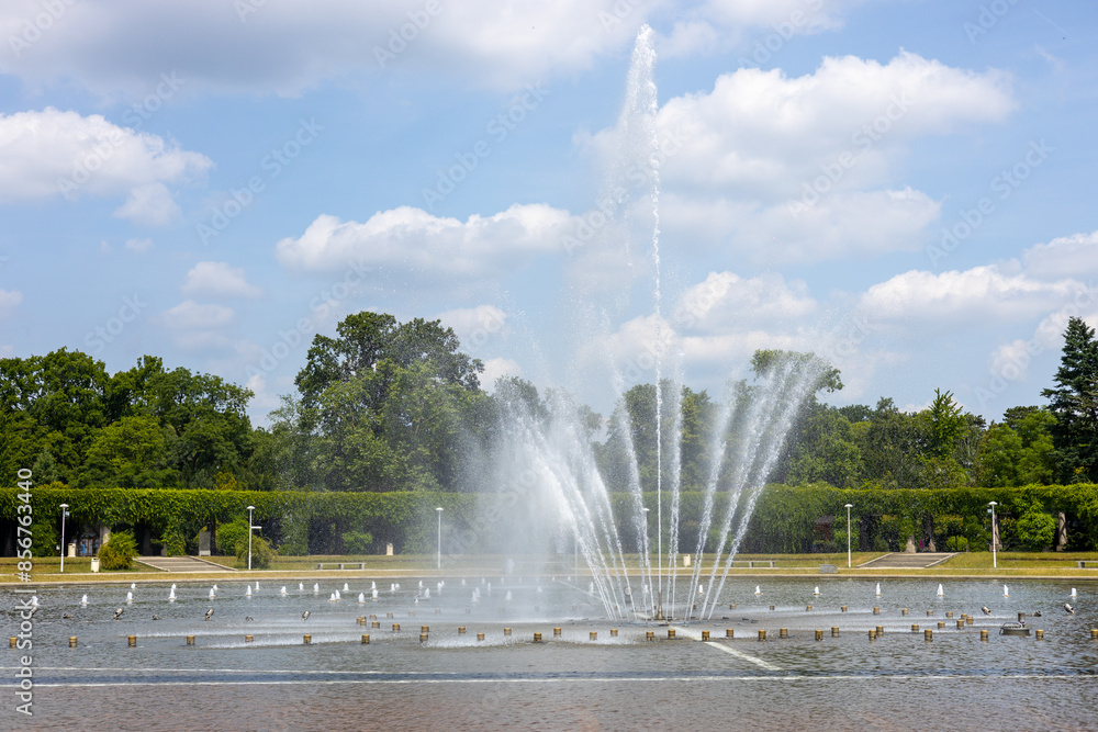 Fototapeta premium Multimedia fountain in Wroclaw, Poland. Sunlight water splashes. Beautiful architecture fountain