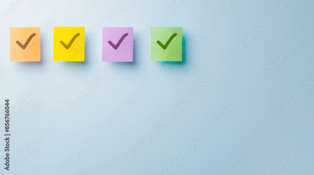 Four colorful sticky notes with check marks on a blue background. Four colorful sticky notes with check marks on a blue background.