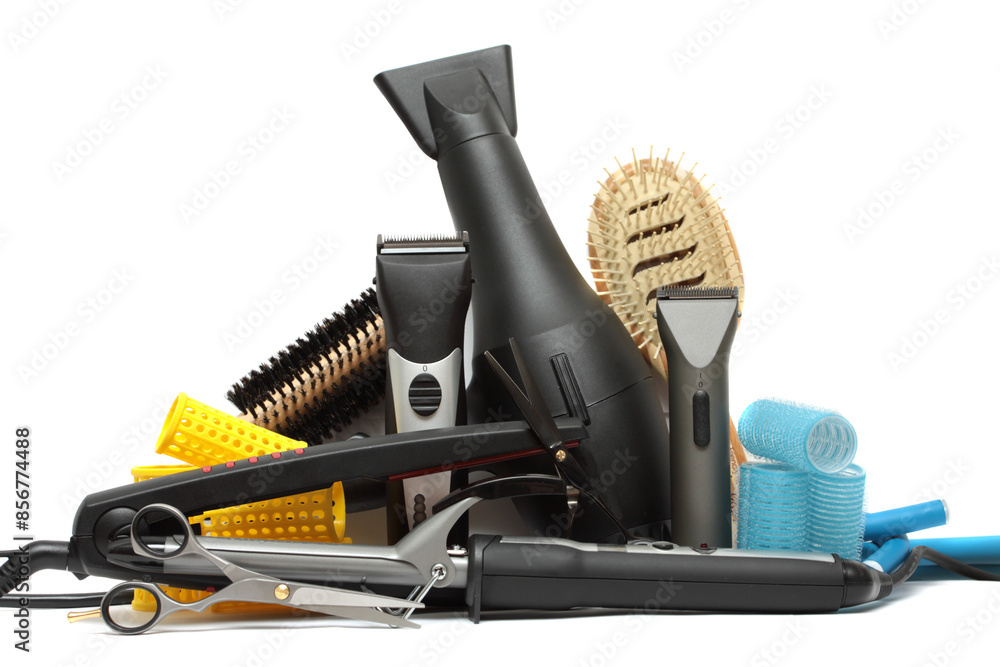 Professional scissor, black hair dryer, curling iron and hair straightener on white background. Hairdresser set. Tools necessary for hair care and styling Professional scissor, black hair dryer, curling iron and hair straightener on white background. Hairdresser set. Tools necessary for hair care and styling