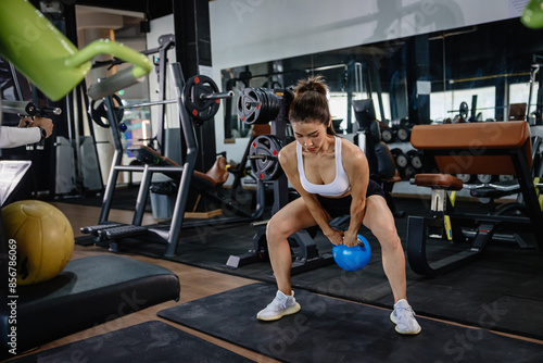 Kettlebell. Sport Healthy women in Kettlebell Training in Fitness Gym. Body Care Weight Training in Sport Club.