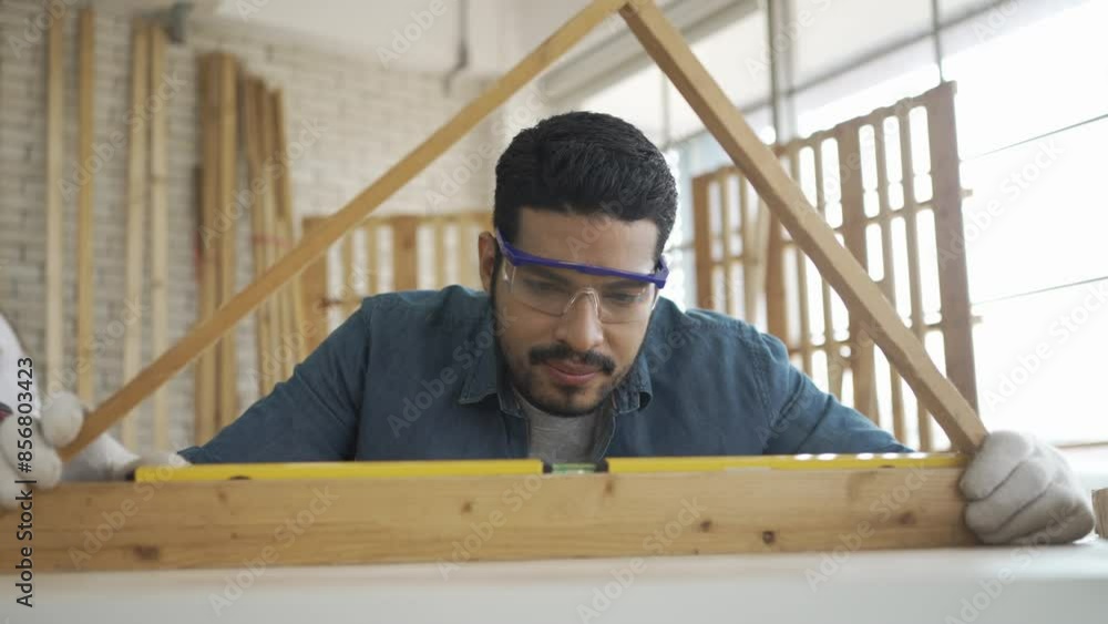 Carpenter is working at woodshop. Carpenter is working at woodshop.