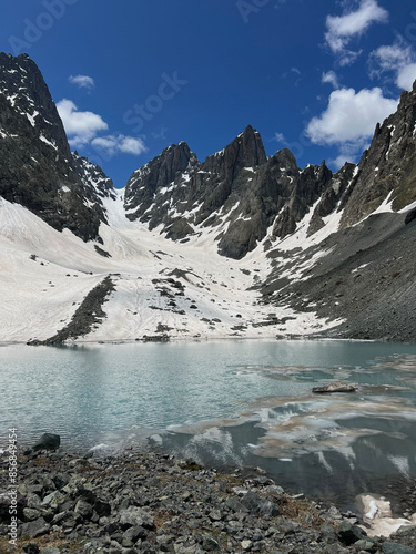 Mountain lake in background with high mountain