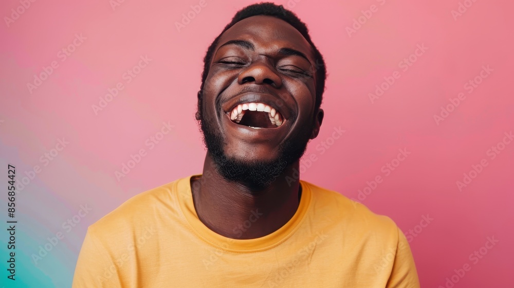 Happy black man laughing in a yellow t-shirt Happy black man laughing in a yellow t-shirt