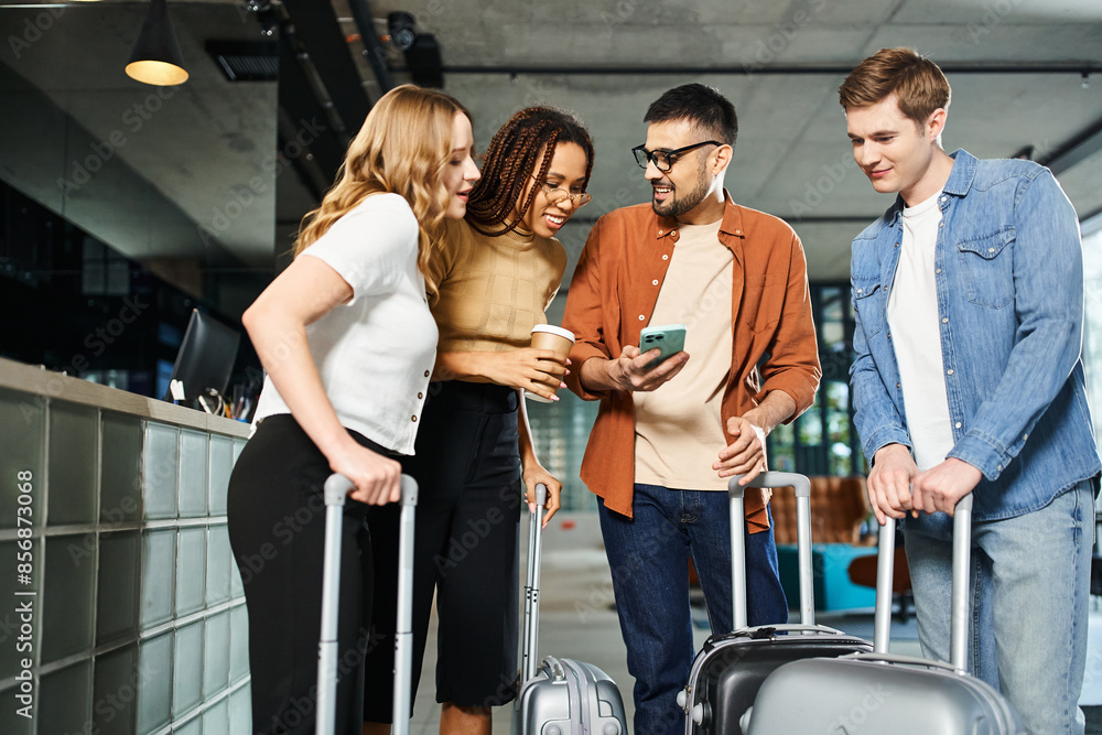 Multicultural colleagues in casual clothing standing around with luggage in a hotel lobby during a corporate trip. Multicultural colleagues in casual clothing standing around with luggage in a hotel lobby during a corporate trip.